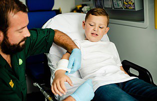 a child in an ambulance in need of a child injury lawyer