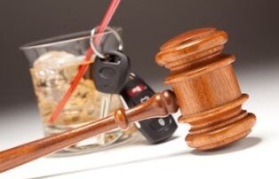 a drink, keys, and gavel
