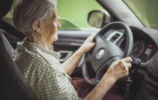 elderly woman driving